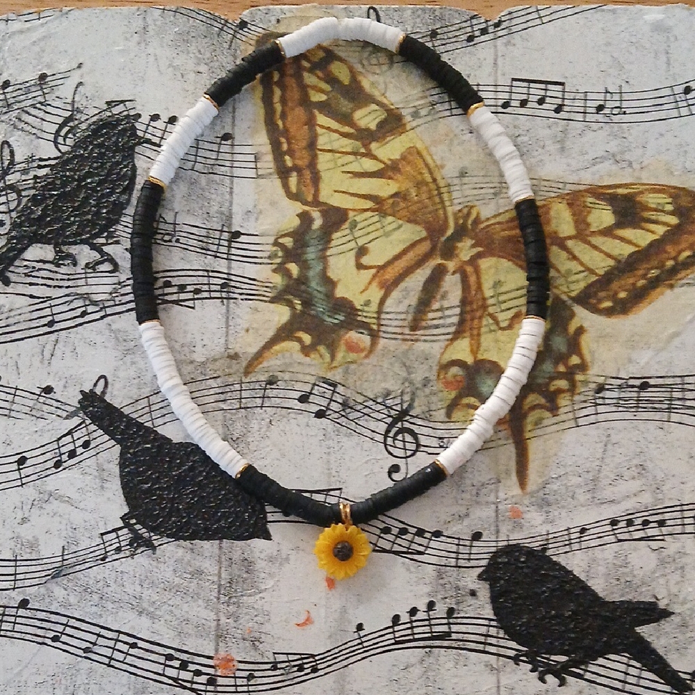 Black and White Beaded Necklace with Yellow Flower Pendant